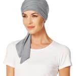 Gray short scarf styled as a head wrap on a woman.