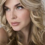 Blonde wavy wig from Hidden Secrets Wigs, styled for a natural look.