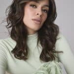 Wavy brunette wig from Hidden Secrets Wigs, styled on a model.