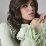 Beautiful woman wearing medium wavy wig from Hidden Secrets Wigs.