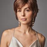 Woman with short brown layered wig from Hidden Secrets Wigs.
