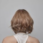 Blonde layered wig from Hidden Secrets Wigs, styled for a natural look.