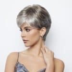 Silver short wig styled on a woman with a sleek look and side parting.