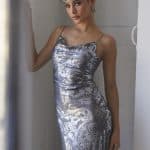 Model wearing a silver patterned dress from Hidden Secrets Wigs collection.