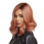 Stylish woman wearing Wavez Muse Collection wig in rose gold color.