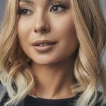 Beautiful blonde wig with soft waves, perfect for a natural look.