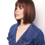 Petite Portia wig with straight, layered brown hair and subtle highlights.