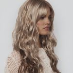 Blonde wavy wig from Hidden Secrets Wigs, styled for a natural look.