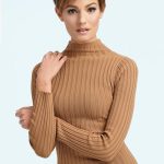 Woman with short, textured hairstyle and warm brown color.
