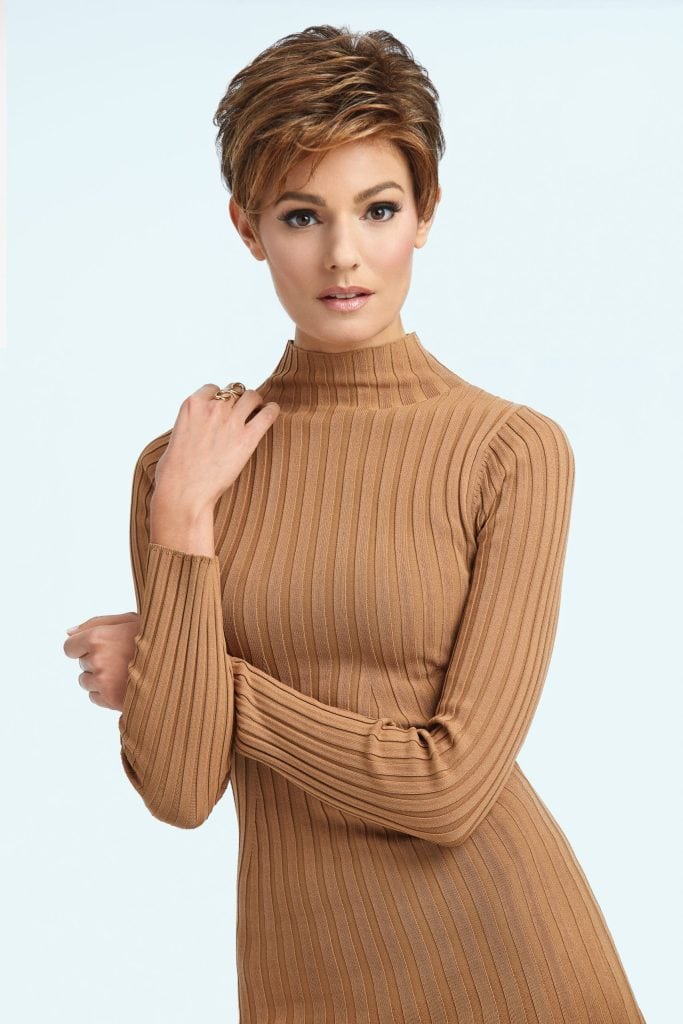 Woman with short, textured hairstyle and warm brown color.