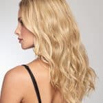 Wavy blonde wig styled for a natural look, 16 inches long, perfect for a stylish appearance.