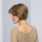 Short layered wig in light brown with side-swept bangs.