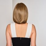 Blonde bob wig styled on a woman with back view.