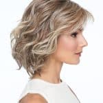 Short wavy blonde wig with layered style for women.
