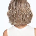 Curly blonde wig with layered short cut for a natural look.