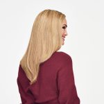 Blonde long straight wig on a woman with side profile view.