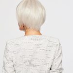 Short white wig on a woman with a stylish bob cut, back view.