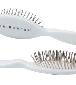 White oval wire brush with metal bristles for wig styling and detangling.