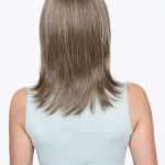 Long straight blonde wig on a woman with light brown hair.