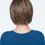 Short brown wig with subtle highlights for a natural look.
