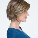 Short layered wig with blonde highlights for a natural look.