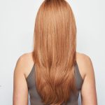 Long auburn wavy wig shown from the back, perfect for a dramatic look.