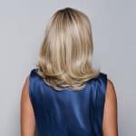 Blonde wavy wig shown from the back, styled with soft waves and layered cut.