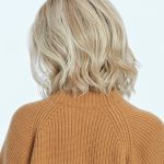 Blonde wavy wig styled for women, perfect for a natural look.
