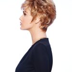 Short layered wig with blonde highlights and textured style.