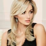 Beautiful blonde layered wig styled for women with soft waves and volume.