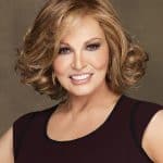 Beautiful blonde wavy wig styled for a sophisticated look.