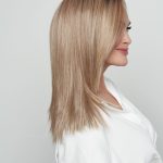 Blonde straight wig on a woman with side profile view.