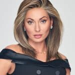 Beautiful woman wearing a stylish blonde wig for a natural look.