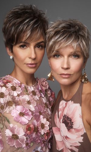 Two women with short, layered, blonde wigs from Hidden Secrets Wigs.