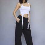 Fashion model with sleek bob hairstyle wearing casual streetwear.