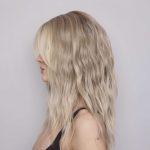 Blonde wavy wig showcasing natural texture and volume for elegant style.