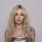 Blonde wavy wig model showcasing Roxie style from Hidden Secrets Wigs.