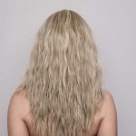 Long blonde wavy wig styled for a natural look from Hidden Secrets Wigs.