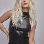 Blonde wavy wig styled on a model for Hidden Secrets Wigs.