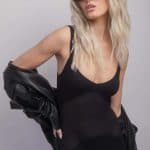Fashion model wearing Roxie wig from Alexander Couture Collection with sunglasses.