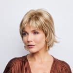 Blonde short wig from Hidden Secrets Wigs, styled for a natural look.