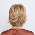 Blonde layered wig from Hidden Secrets Wigs, styled for a natural look.