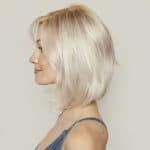 Blonde layered wig from Hidden Secrets Wigs, styled for a natural look.