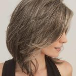 Elegant short layered wig in ash blonde from Hidden Secrets Wigs.