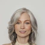 Elegant silver wig from Hidden Secrets Wigs, Sheena style, with soft waves and natural look.