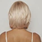 Blonde layered wig from Hidden Secrets Wigs, back view.