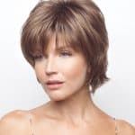 Women with short layered wig in light brown from Hidden Secrets Wigs.