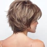 Short layered wig in light brown with blonde highlights for women.