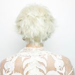 White curly wig for women, stylish and voluminous, perfect for special occasions.