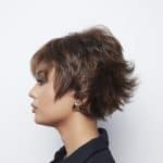 Short curly wig for women, stylish and natural look, perfect for fashion and everyday wear.